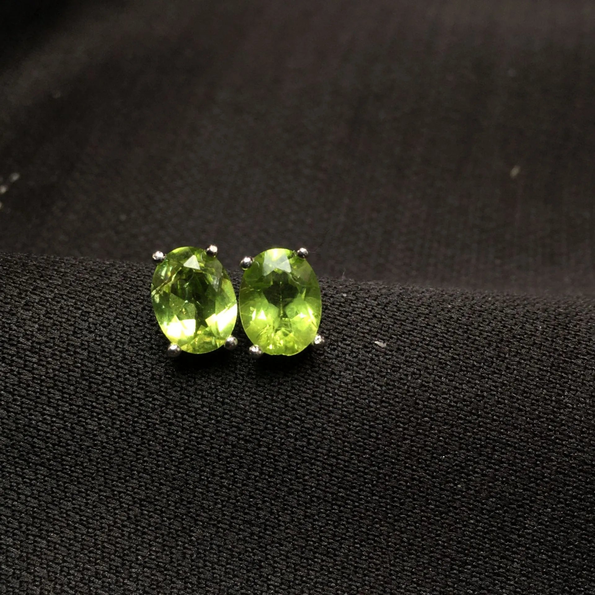 Natural grass green olivine faceted stud earrings in S925 sterling silver setting.