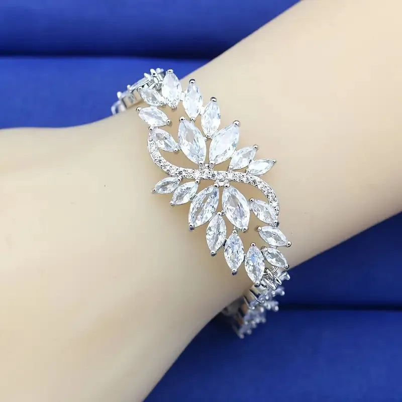 Gold electroplated bracelet with coloured zircon stones and ice flowers pattern on copper.