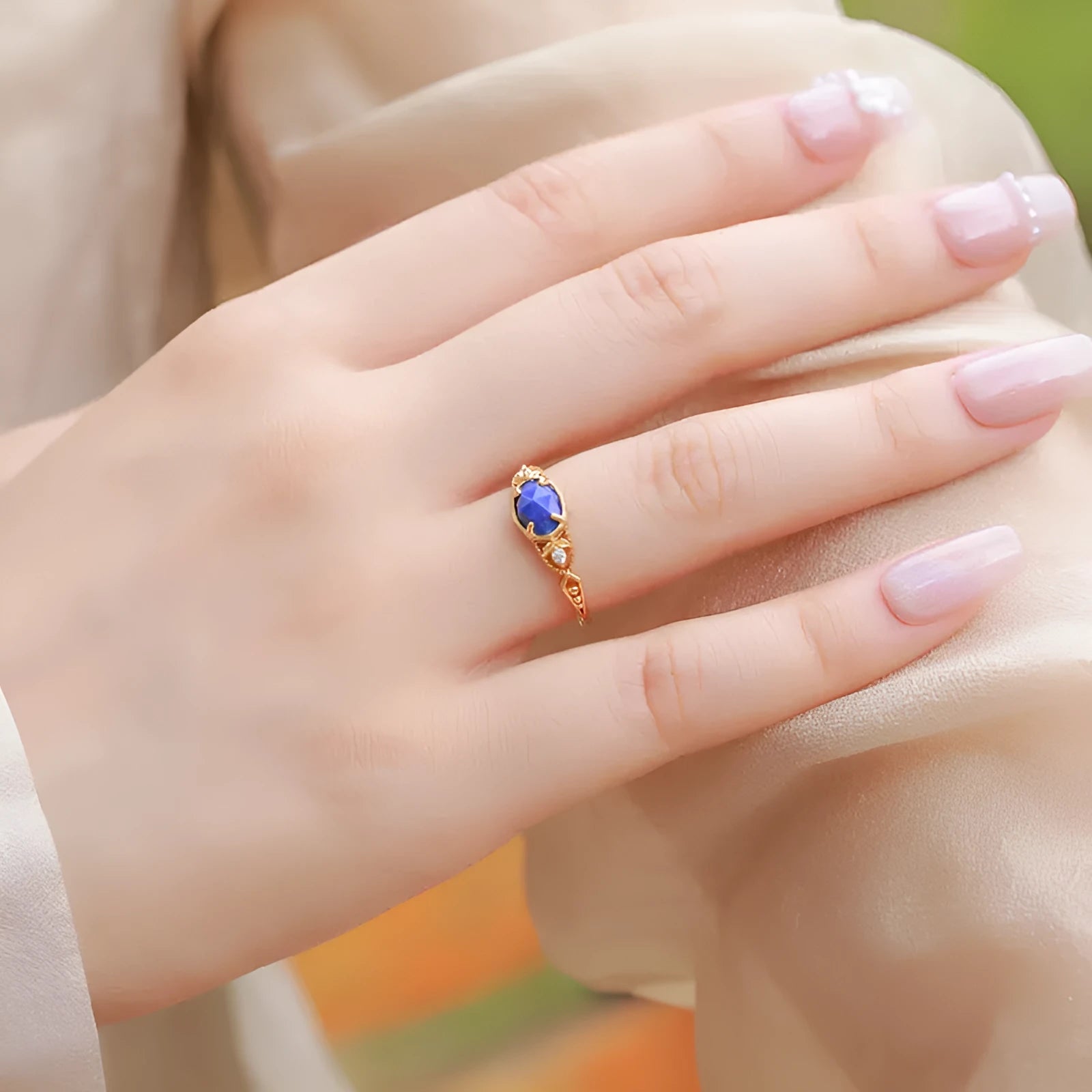 Geometric silver alloy ring with deep blue lapis lazuli stone in elliptical setting
