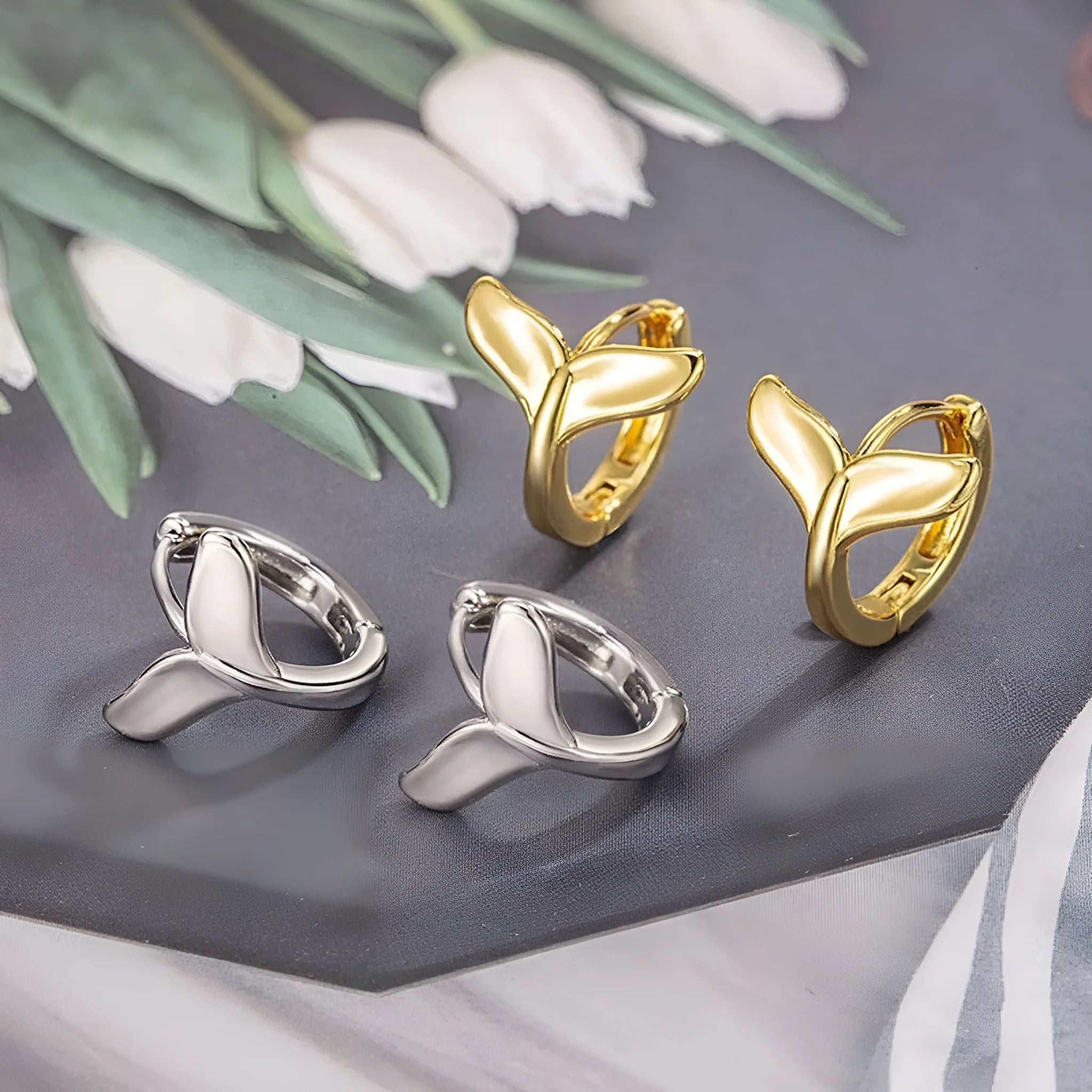 Women's fashion earrings with fishtail design in electroplated white gold or yellow gold finish