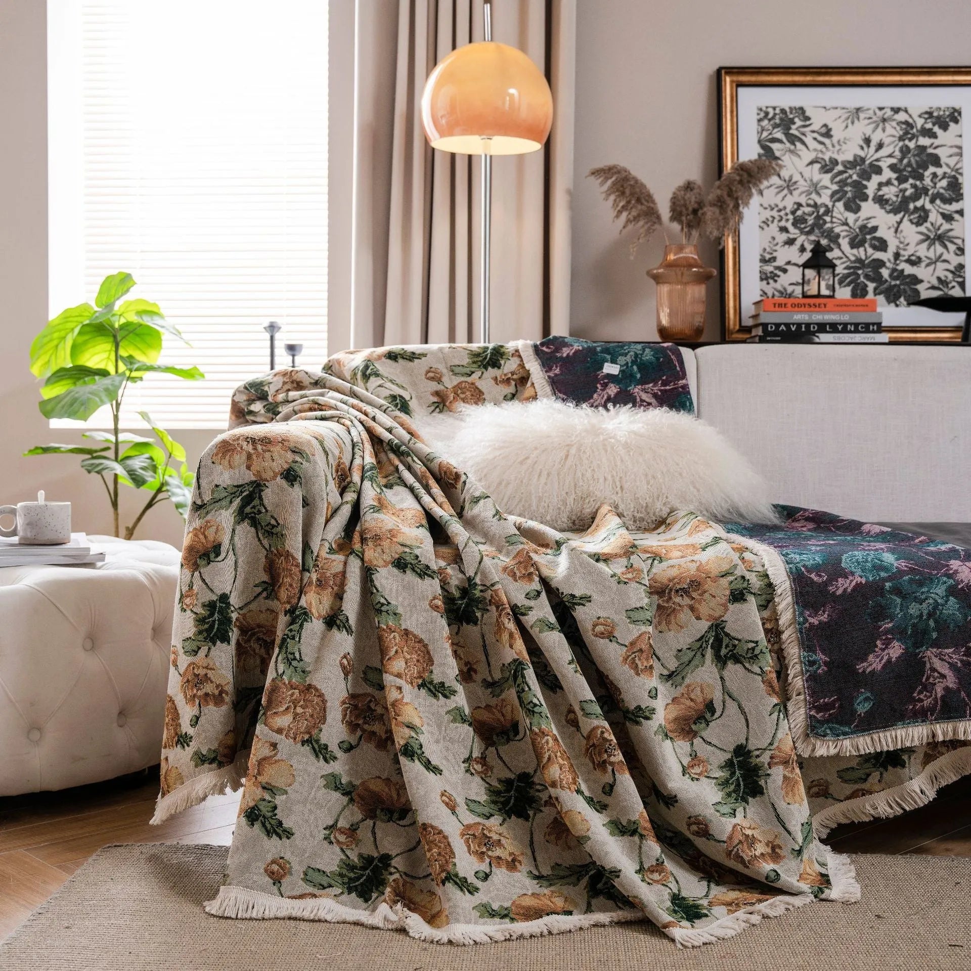 American country retro jacquard sofa cover in a cherry pattern on a white background, draped over a sofa.
