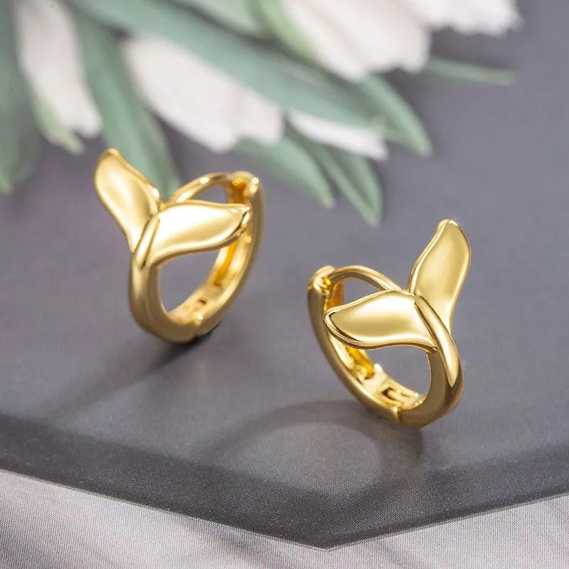 Women's fashion earrings with fishtail design in electroplated white gold or yellow gold finish
