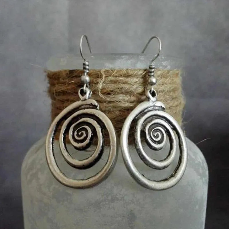 Silver geometric spiral distressed alloy earrings with national style design measuring 2.6 cm wide by 5 cm long