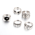 Black alloy ring with a raised spade card design on a band for women.