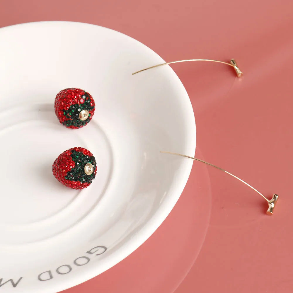 Geometric zinc alloy strawberry earrings for women in red with spot drill detail.