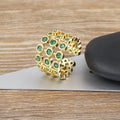 Copper ring with 18K gold plating and green zircon stones in wide band design