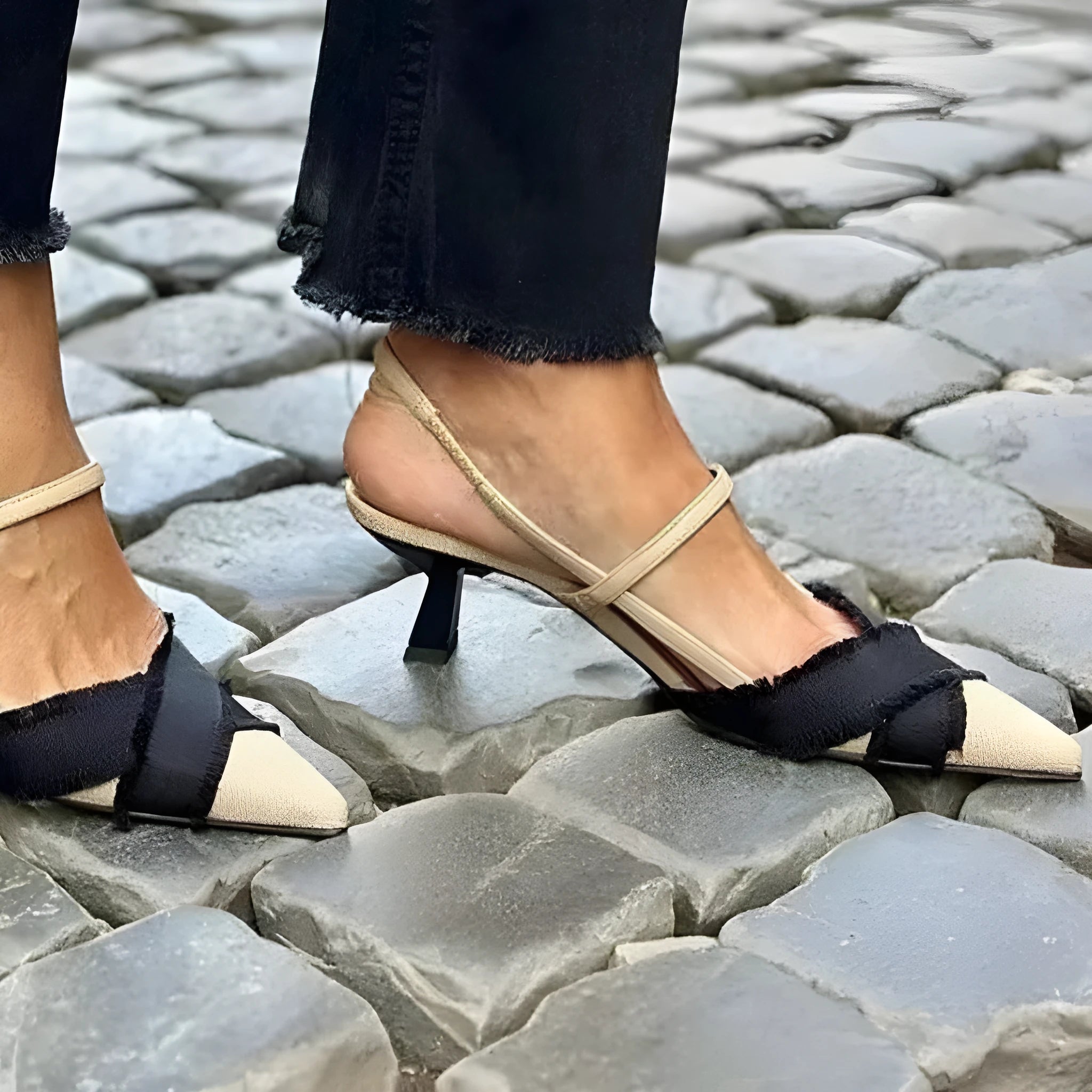 Apricot and black colour block women's stiletto heel sandals with a buckle fastening and pointed toe.