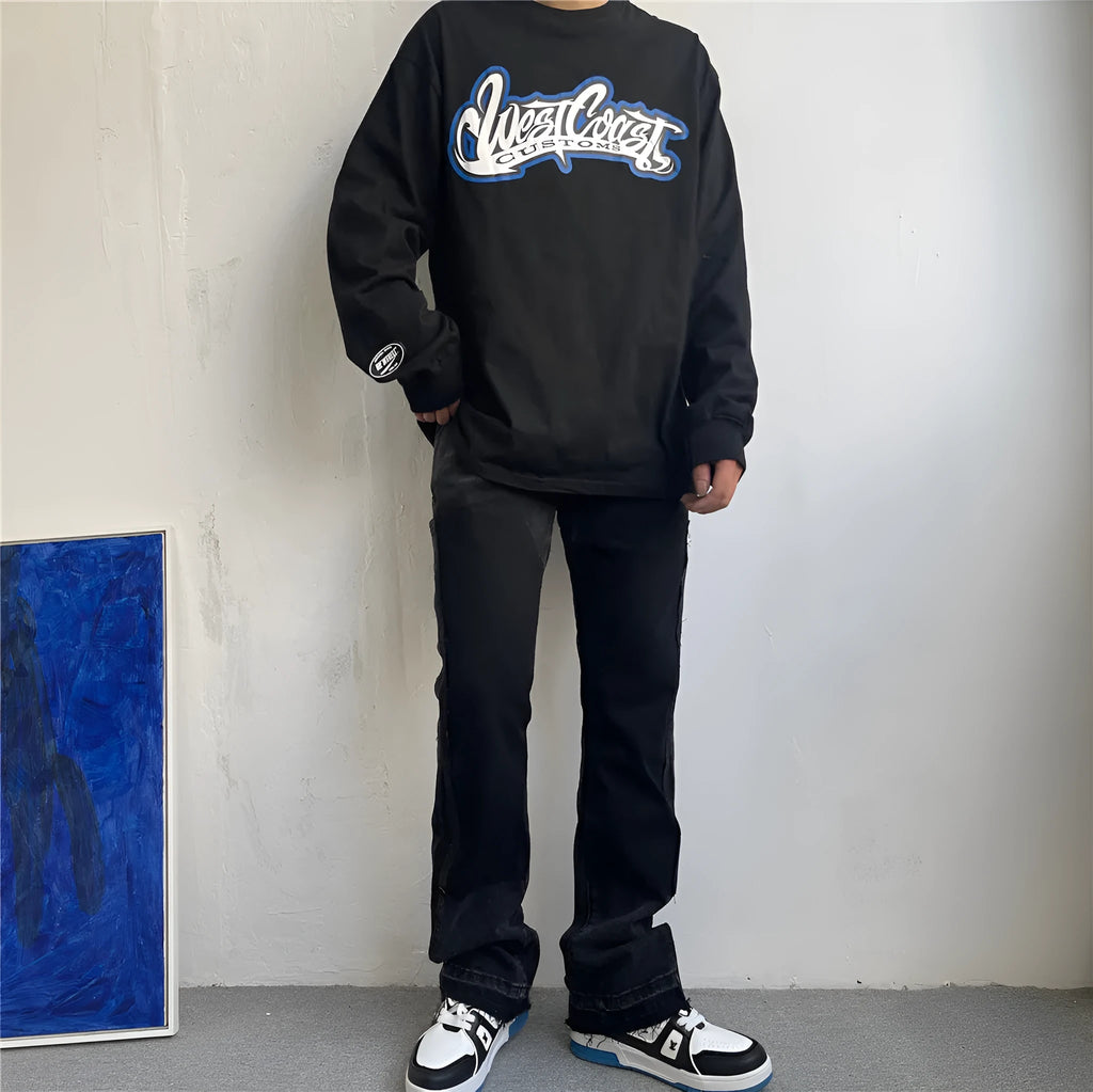 Black micro flared patchwork raw edge jeans on model showing loose straight tube fit