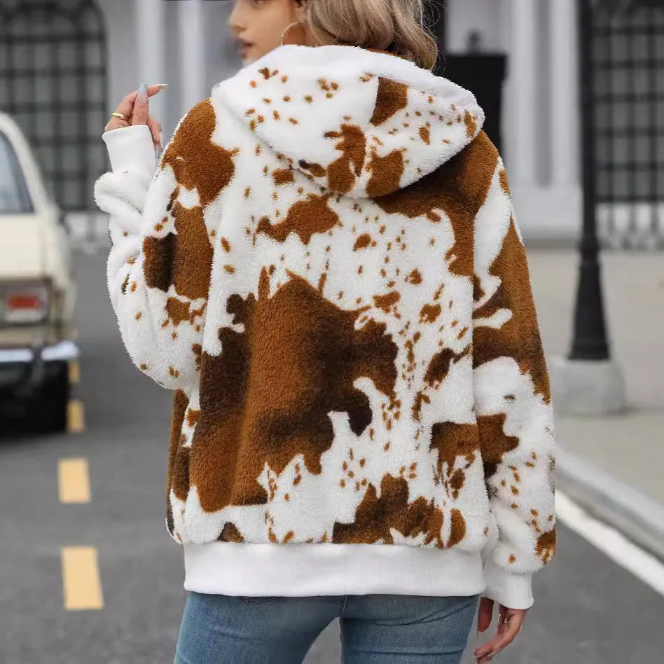 Yellow brown cow print hooded cardigan jacket with front zipper on female model