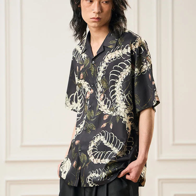 Short sleeve Cuban collar shirt with a snake bone and floral pattern in a loose fit.