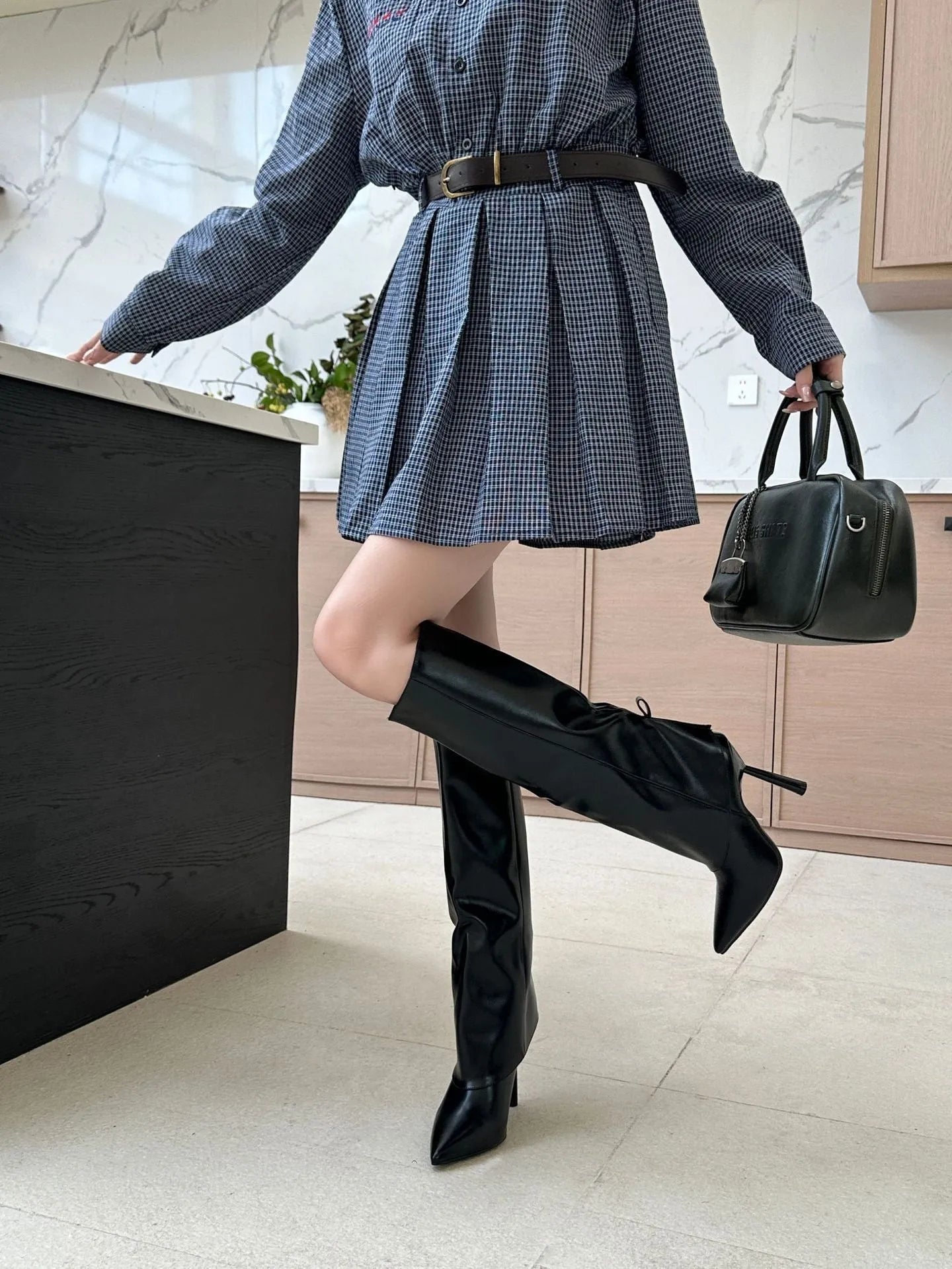 Black slimming leg warmer boot with stiletto heel, shown as an oversleeve design.
