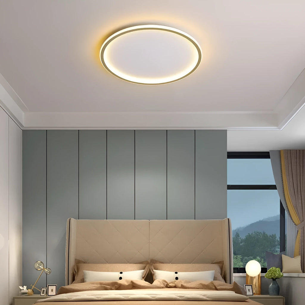 Modern circular minimalist LED ceiling lamp in black finish, shown mounted on a white ceiling.