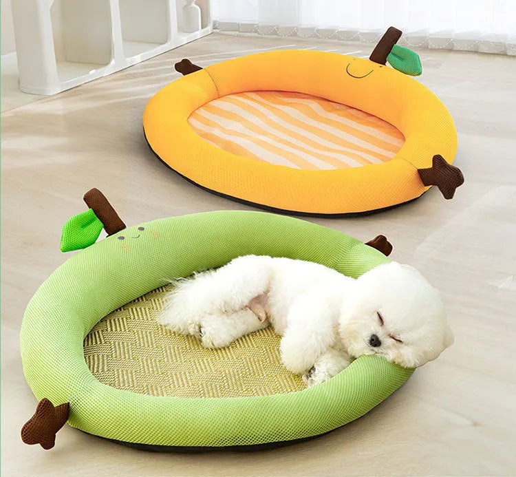 Green pet cooling mat with a raised fruit-shaped backrest for dogs and cats.