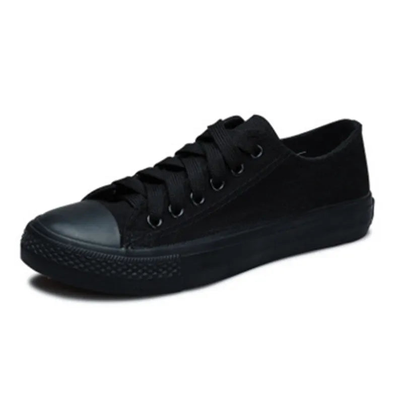 Women's casual canvas shoes in solid colours: all-black, black, white-black, and white-red.