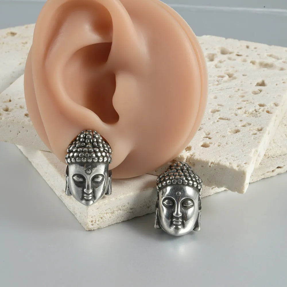 Stainless steel hollow skull and Buddha head geometric earrings for men and women.
