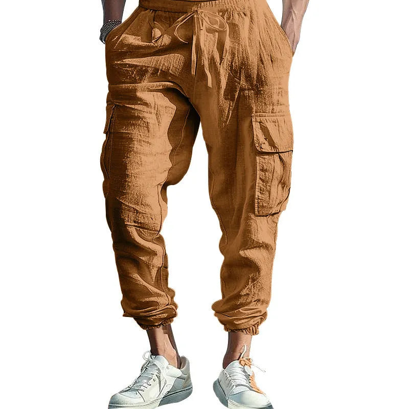 Men's solid colour linen casual trousers with ankle ties and multiple pockets in a loose fit.