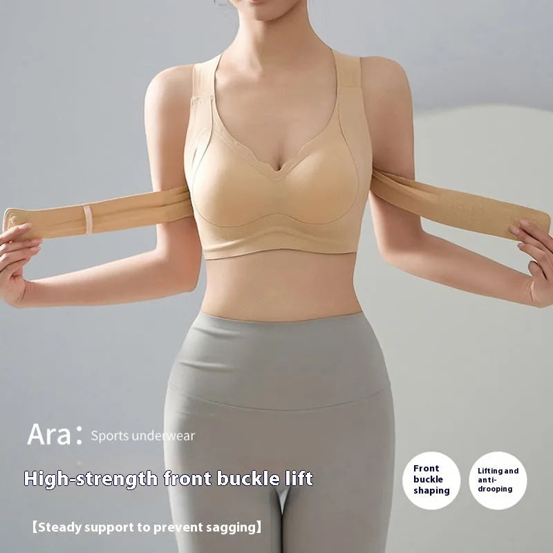 Women's front buckle sports bra in black with back shaping and double shoulder straps
