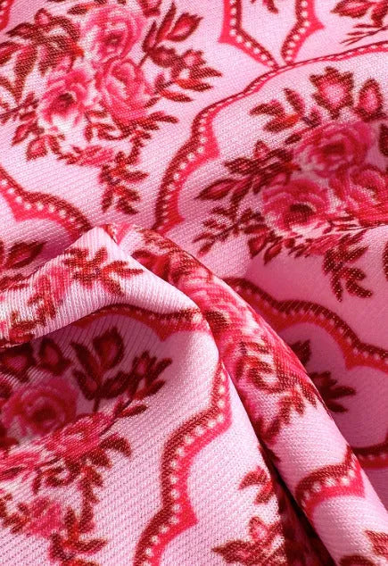 Pink printed two-piece bikini set with shoulder straps and exposed back cut-out for ladies