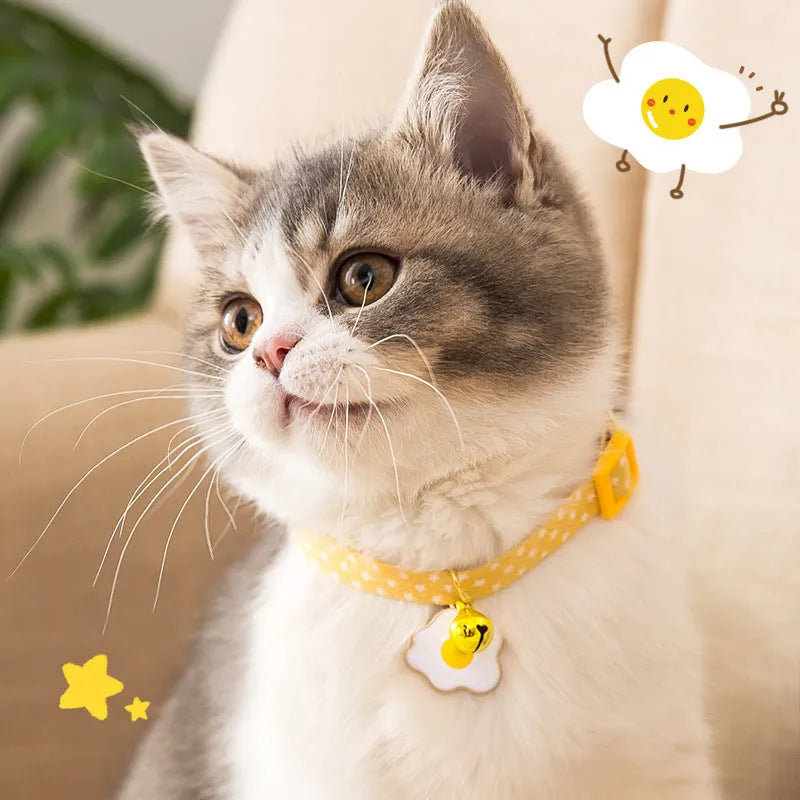 Adjustable cat collar with bell and bow tie decoration on small dog