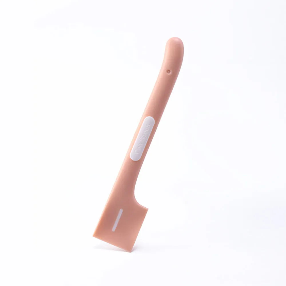Green pet feeding spoon with long handle and right-angle edge for scraping canned dog or cat food.