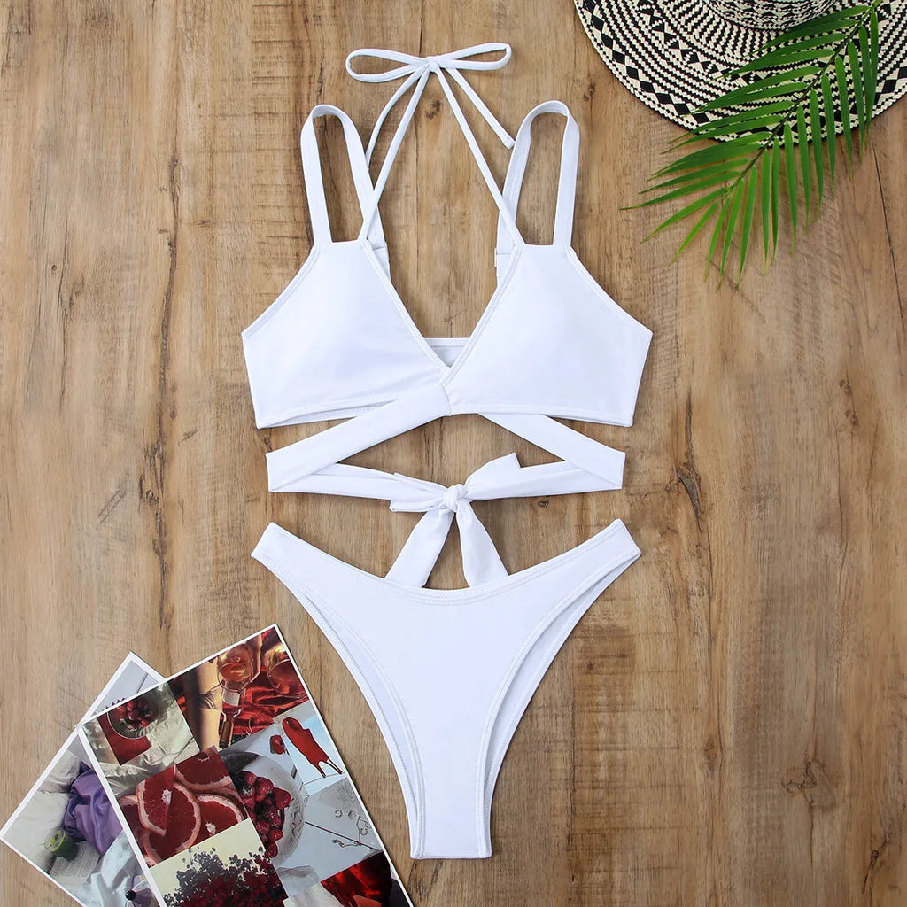 Women's solid colour strap bikini swimsuit in brief style on a white background.