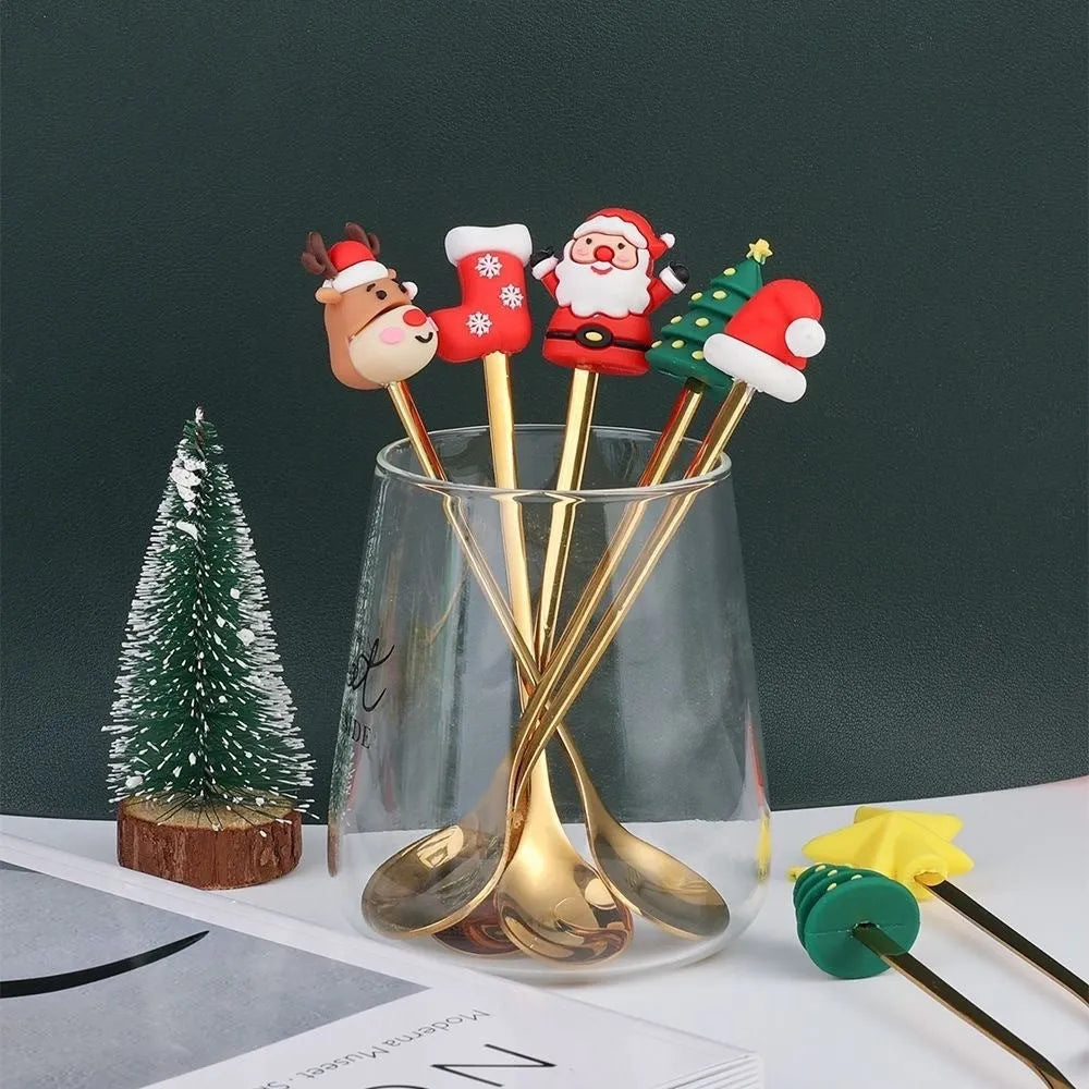 Red stainless steel Christmas spoons and forks with snowman, tree, and Santa handle designs.