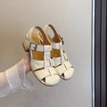 Women's apricot buckle shoes with round toe, two-layer cowhide upper, and rubber sole on a plain background