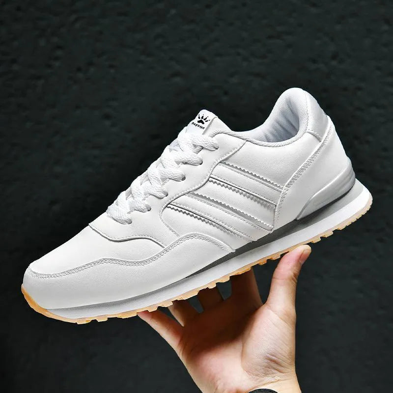 Men's black casual running shoes with carved wing pattern and a high heel.