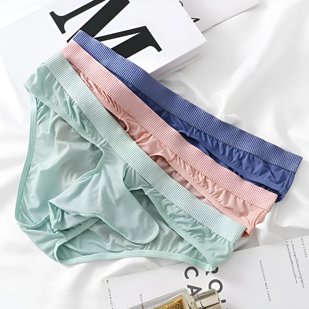 Men's low waist ice silk briefs in black, grey, light green, pink, and purplish blue colours on a size chart.