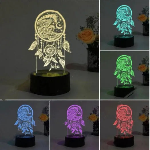 Modern acrylic dream catcher night light on a table showing colourful light modes, with a remote control nearby.