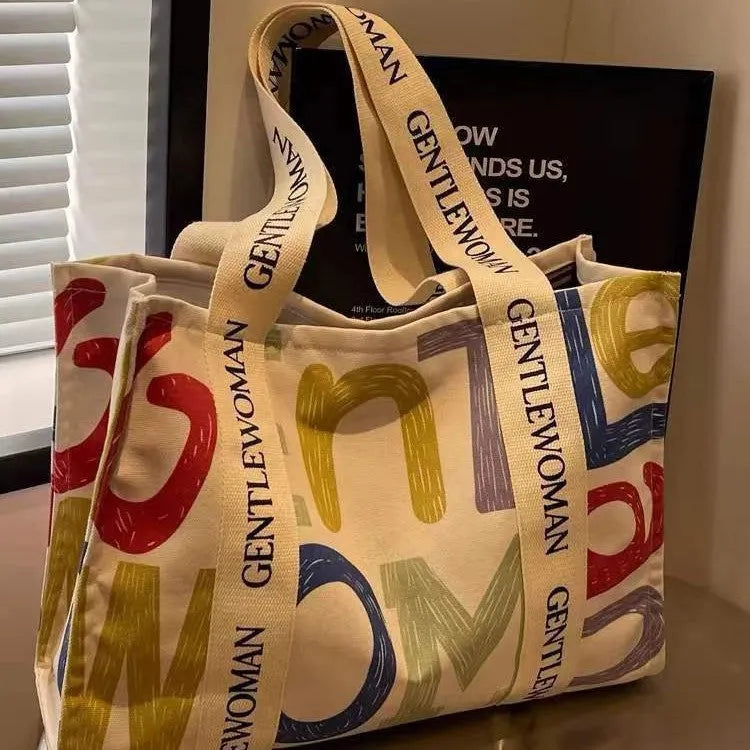 Canvas shoulder tote bag with printed design, large capacity for shopping and travel