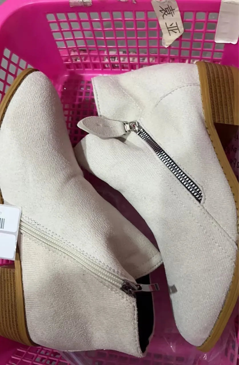 Women's suede ankle boots with a chunky heel and side zip fastening in beige colour.