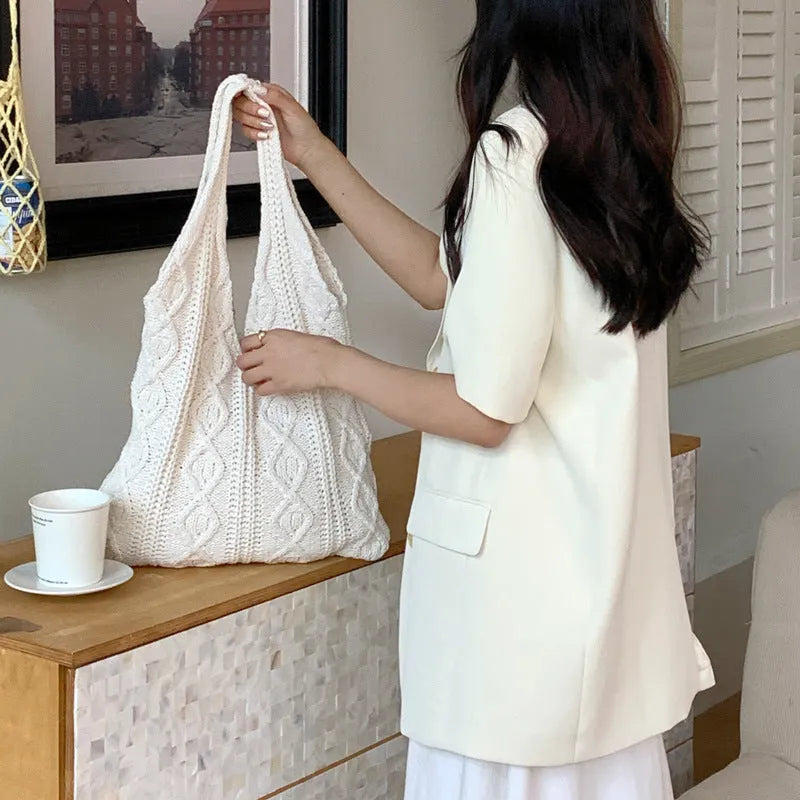 Large retro hollow knitted women's shoulder tote bag in a solid colour with double straps.