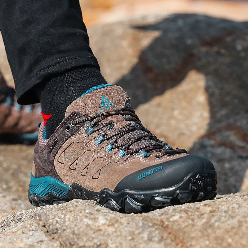 Men's black low top lightweight hiking shoes with EVA outsole and rubber sole on outdoor trail