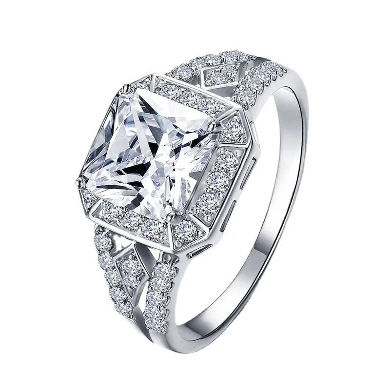 Women's geometric ring with hollow design and inlaid zircon stone in platinum colour.