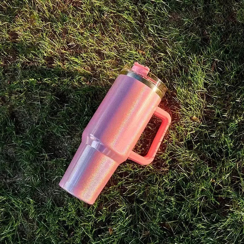 Large stainless steel vacuum cup in a rainbow colour gradient showing its size and lid.