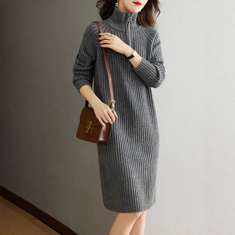 Beige casual women's skirt with half front zipper, stand collar, and long sleeves on a hanger.