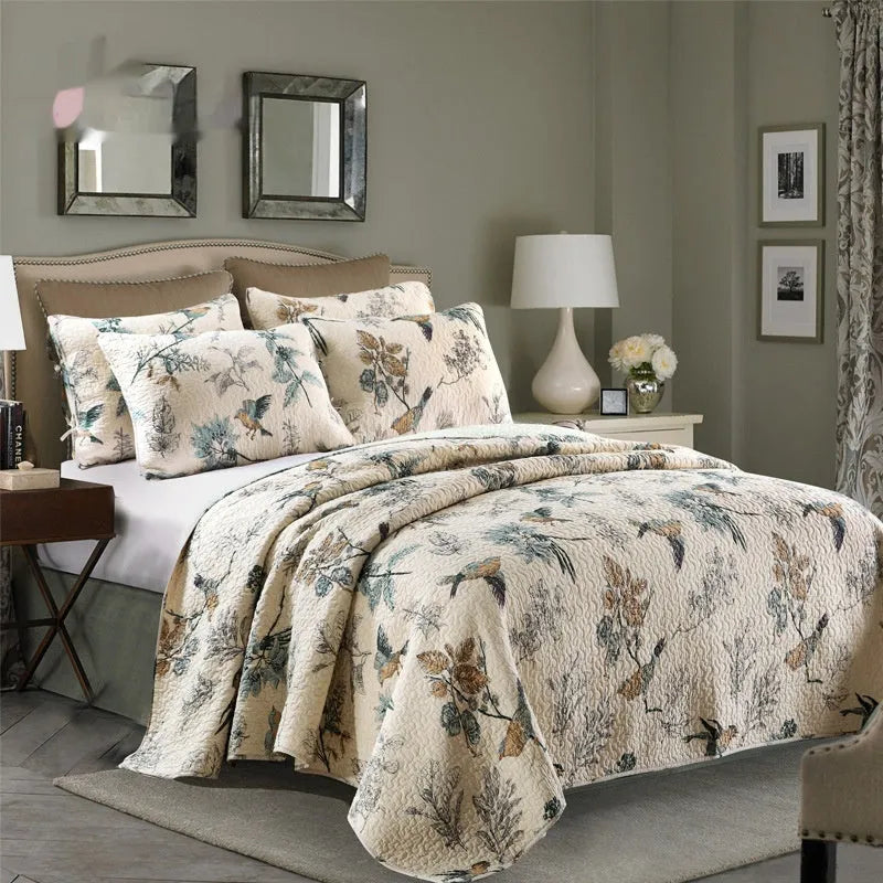 Quilted pure cotton bed cover set with printed pattern, shown with two matching pillowcases on a bed.