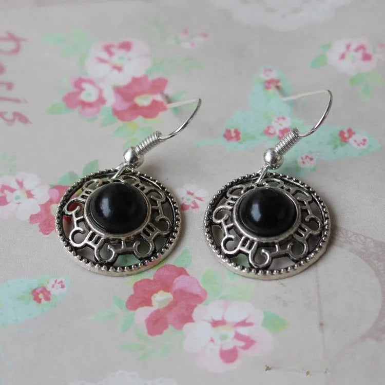 Handmade ethnic Miao silver geometric flower disk earrings with turquoise, in black, blue, or red.