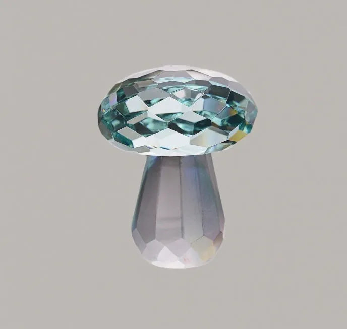 Colourful geometric mushroom crystal decorative ornament in transparent, green, red, or yellow.