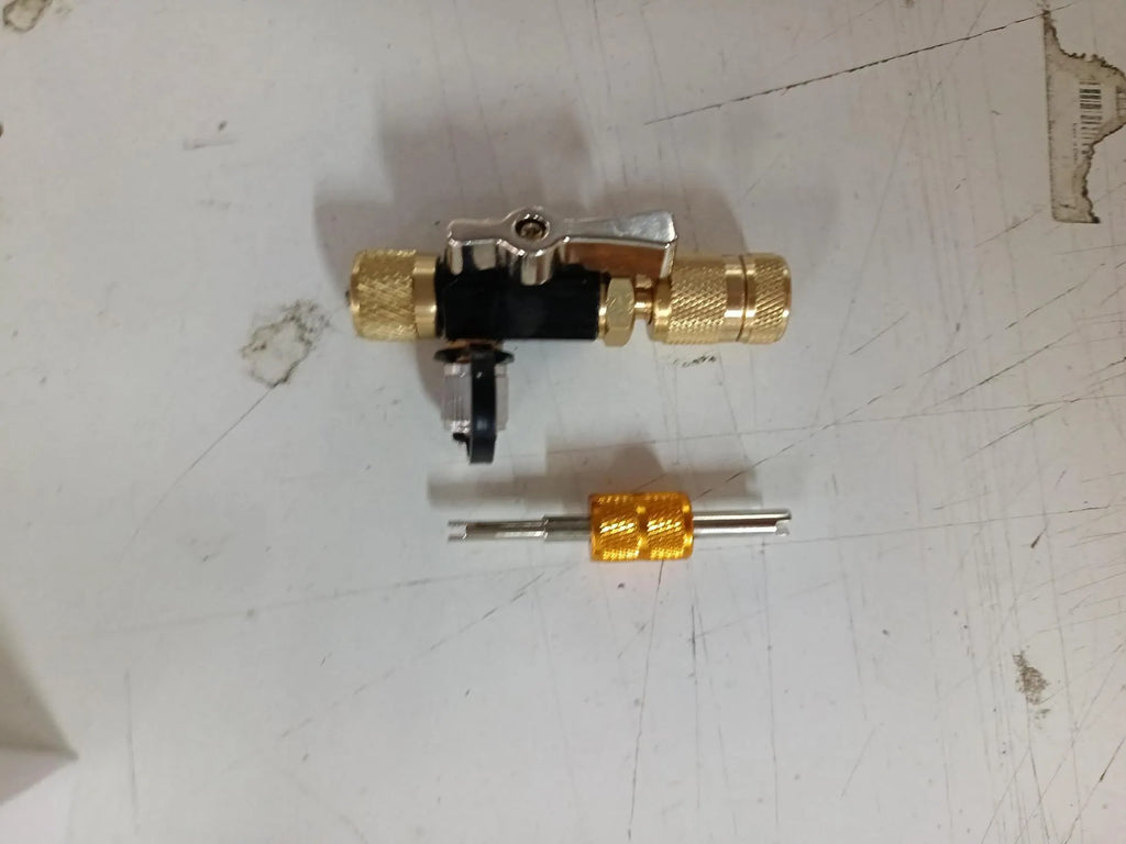 Vacuum valve core disassembly tool set with black and pink metal removers