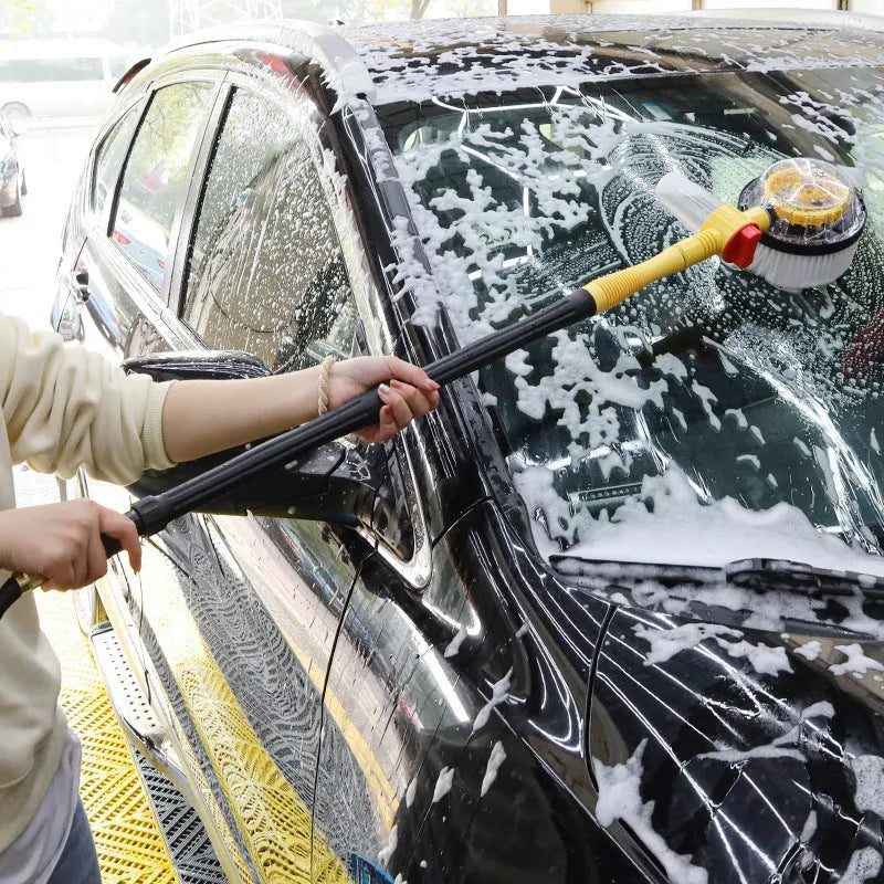 Bright yellow car wash mop cleaning tool with a long hose and a brush head featuring chenille and outer plastic bristles.