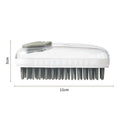 Grey and pink silicone pet bath brush for dogs and cats, handheld with soft bristles.