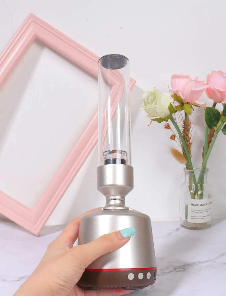 White silver candlelight Bluetooth speaker night light with modern simple design.