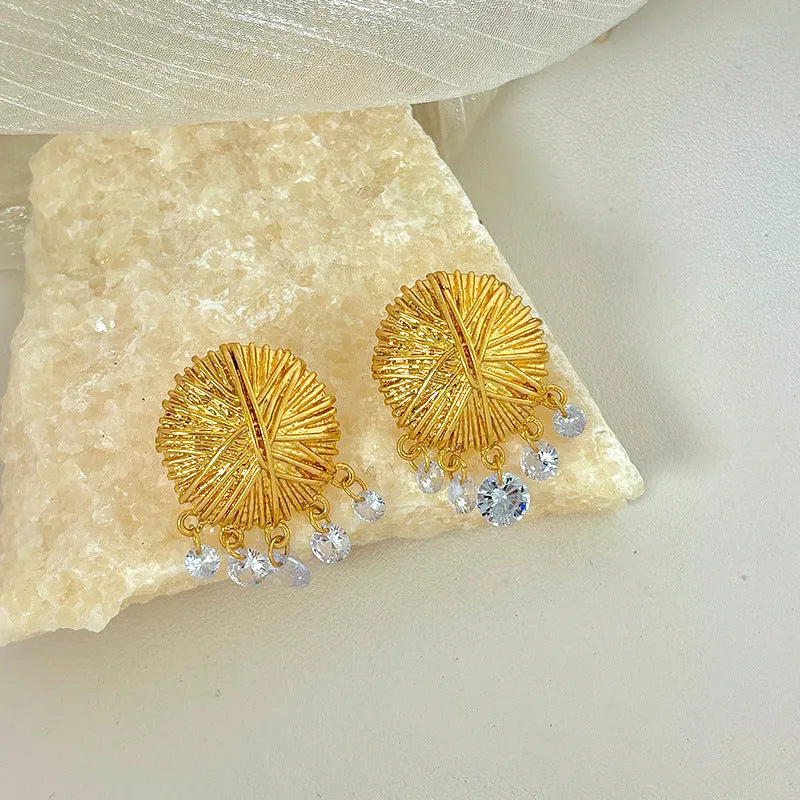Gold geometric women's earrings with round elements in electroplated metal