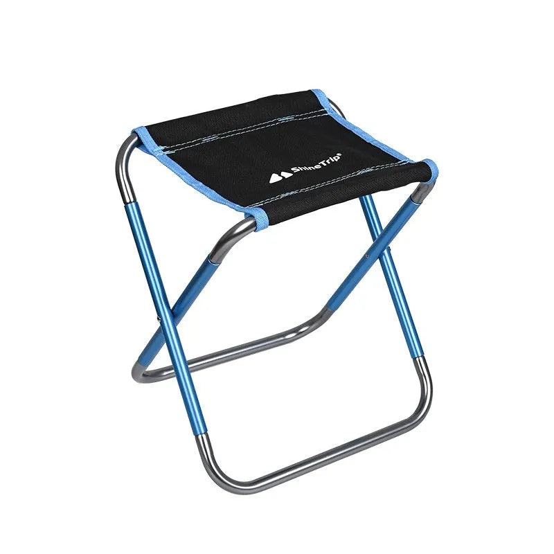 Black aluminium alloy folding camp stool in the open seating position.