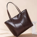 Women's soft cowhide leather shoulder bag in retro brown colour showing external slit pocket and single strap.