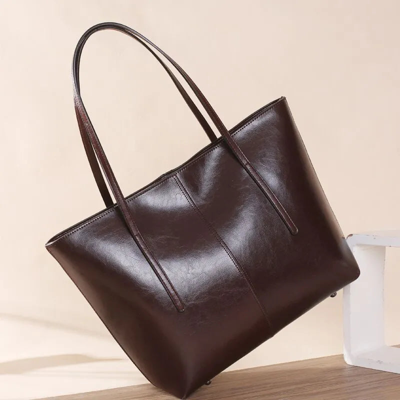 Women's soft cowhide leather shoulder bag in retro brown colour showing external slit pocket and single strap.