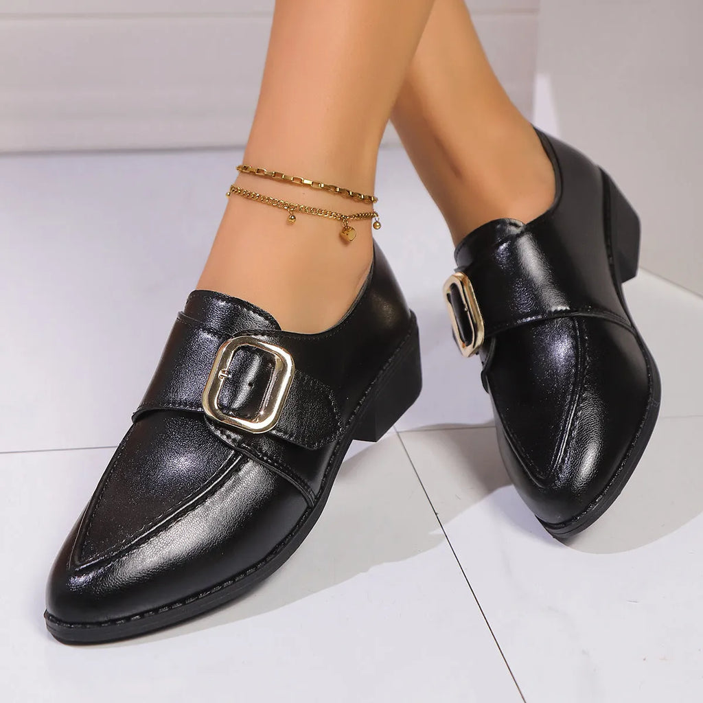 Women's simple leather-look flat shoes with a decorative bow, shown in slip-on style with a rubber sole.