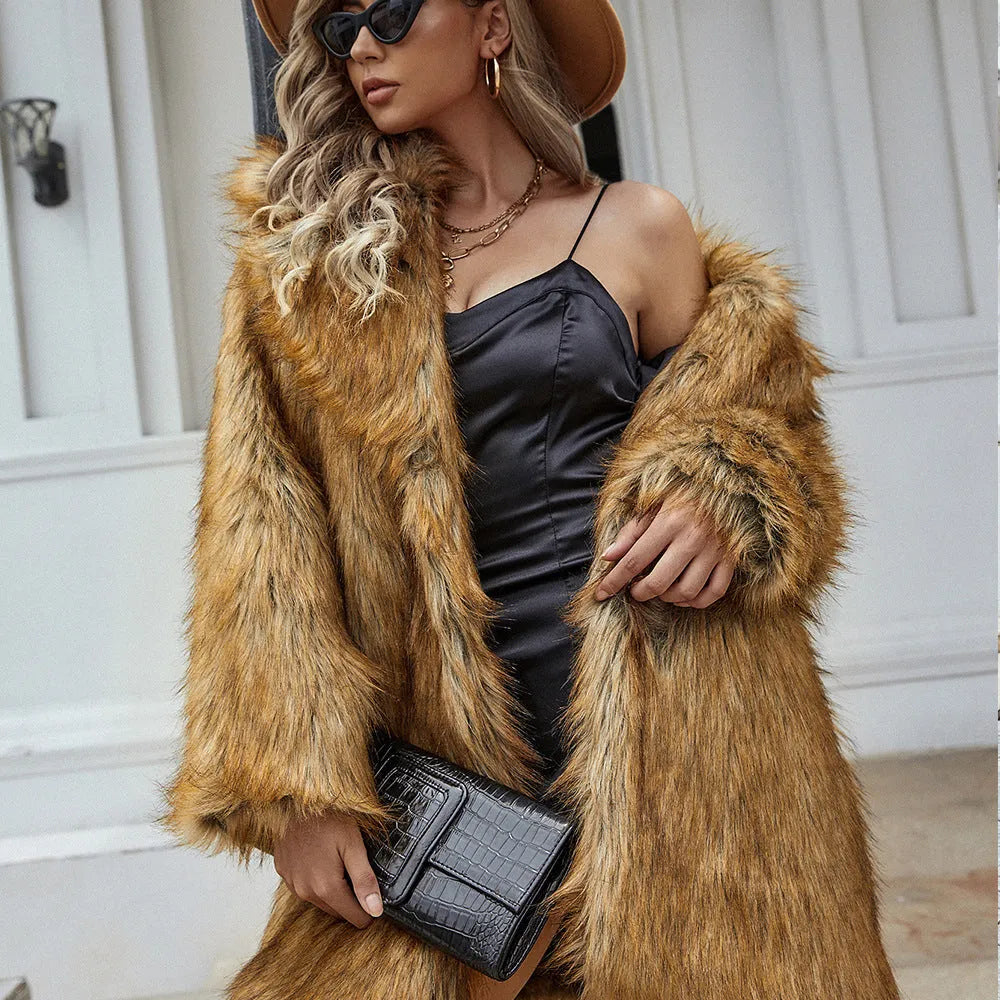 Yellow loose-fitting women's faux fur coat with regular sleeves on a model.